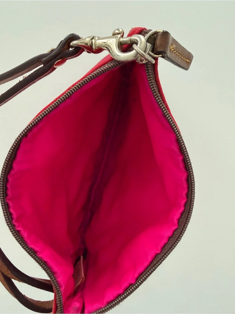 Dooney & Bourke Tan and Red Wristlet with pink interior and Brown Strap